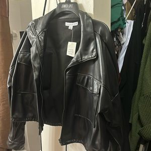 Black faux leather crop jacket.